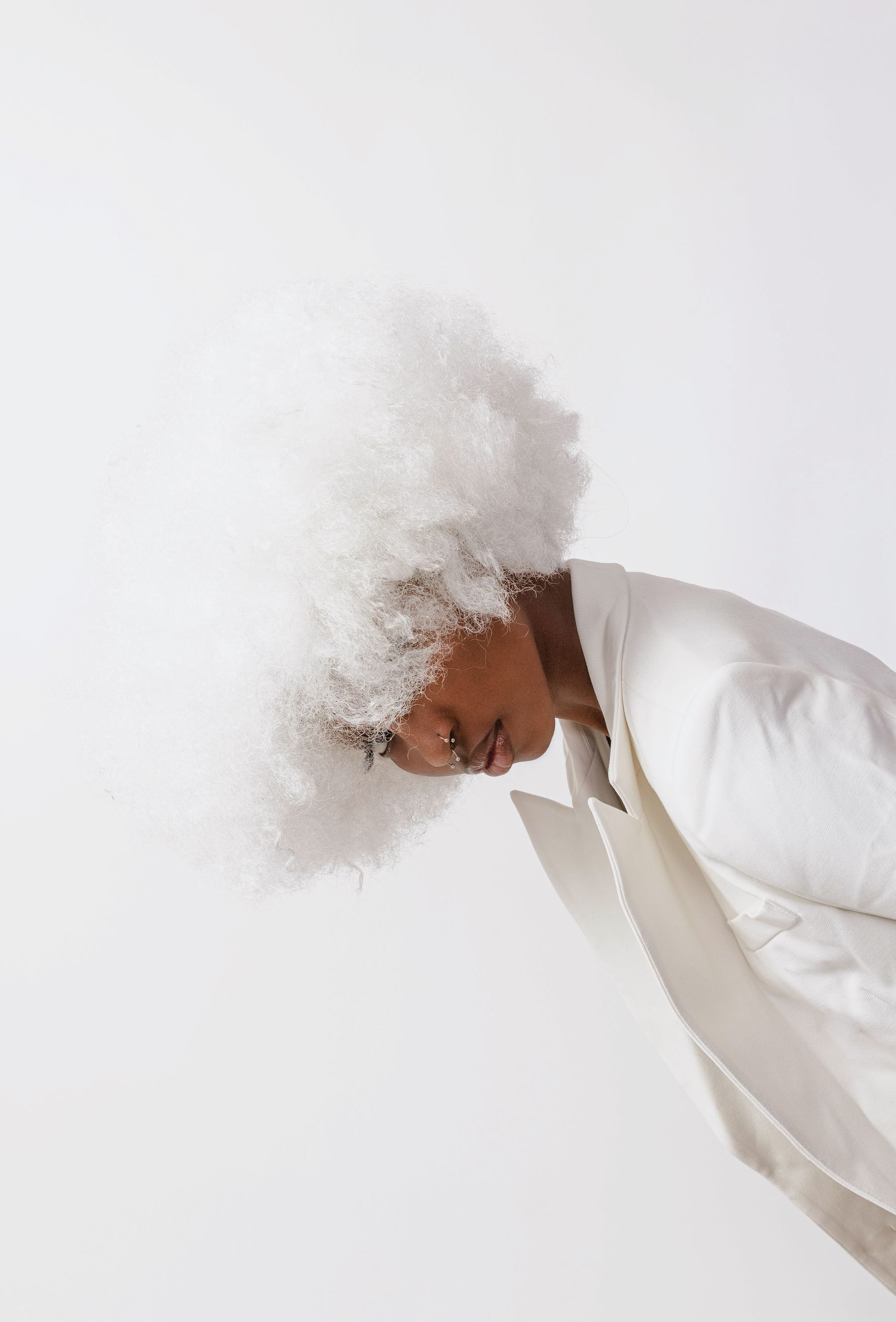 Woman in a white curly wig